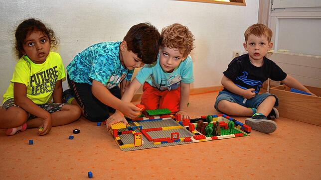 Diesen Vier- bis Fünfjährigen macht der Kindergarten Spaß. Doch die Gebühren für ihre Betreuung sind manchen Eltern zu hoch.