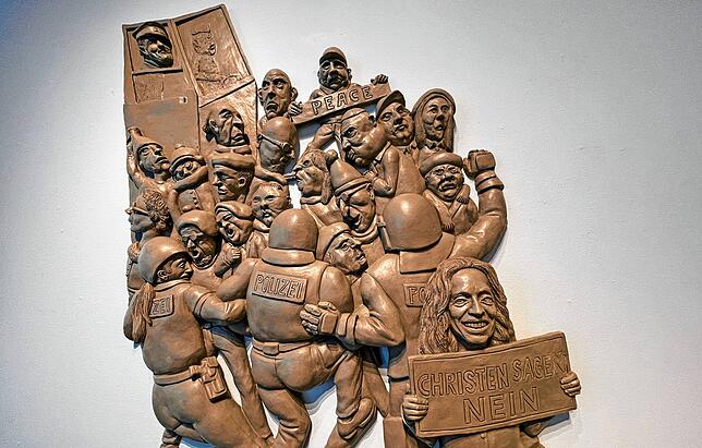„Christen sagen nein“, hält die Frau im Vordergrund hoch. Ein vermeintliches Wimmelbild, das bei näherer Betrachtung trocken ...