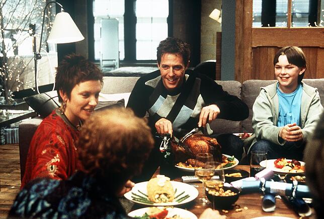 Toni Collette (von links), Hugh Grant und Nicholas Hoult in einer Szene des Films &bdquo;About A Boy&ldquo;.