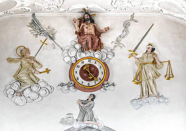 Jesus über einer Uhr: Wo ist dieses Wandbildnis verortet?