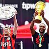 Leverkusens Torhüter Lukas Hradecky (links) und Leverkusens Jonathan Tah präsentieren bei der Meisterfeier in der BayArena die ...