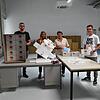Endverpackung der Schutzmasken in einem Raum des Villinger Hoerco-Elektromarkts: (von links) Alexander Hoer, Maschinenbediener und ...