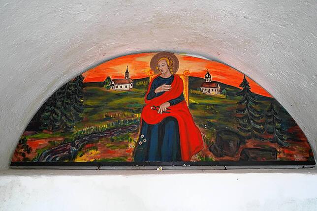 Ein Kunstwerk mit Märtyrerin: Die heilige Apollonia mit Zange und Zahn.