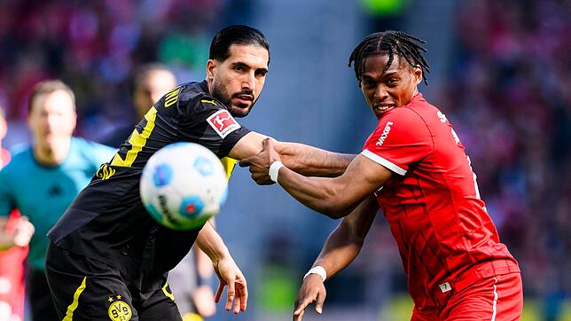 Zwischen Emre Can (l.) mit Borussia Dortmund und dem Junior Adamu und dem SC Freiburg kommt es am letzten Spieltag zum Fernduell.