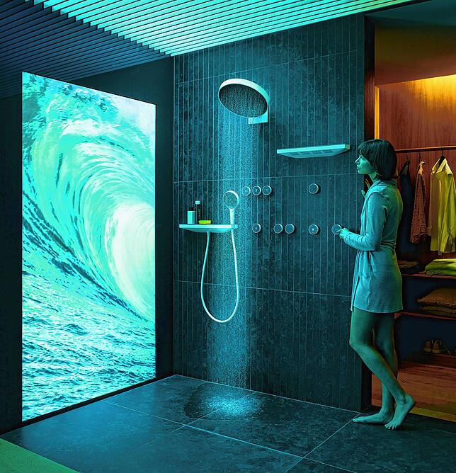 Mit den Bedienelementen an der Wand lässt sich das digitale Duschsystem Raintunes individuell anpassen. Auch Licht und Bilder lassen ...