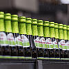 Radler-Biere stehen bei Rothaus auf einem Förderband.