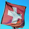 Die Schweizer Nationalflagge wehr in Basel. Das Land ist laut dem schweizerischen Nachrichtendienst eine Hochburg für russische Agenten.