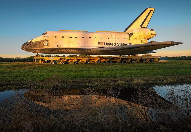Space Shuttle Atlantis FILE - A handout picture released by NASA showing Space shuttle Atlantis as it rolls down Kennedy Parkway on its way to its new home at ...