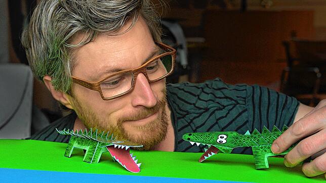 Bild : Ein Krokodil gegen die Langeweile: Wir zeigen, wie Sie dieses grüne Papiertier mit Ihren Kindern nachbasteln