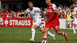 Mühelos in Runde zwei: Niklas Dorsch (l.) mit Heidenheim.
