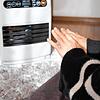 Eine Frau wärmt sich die Hände an einem elektrischen Heizlüfter. Vor dem Hintergrund einer drohenden Gasknappheit setzen viele ...