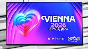 Eine große Tafel weist in der Stadthalle auf den ESC 2026 hin. Wien ist Austragungsort des 70. Eurovision Song Contests, dessen Finale ...