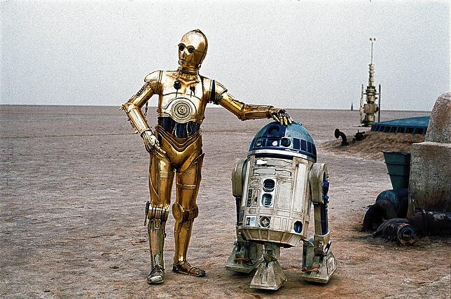 Einer der berühmtesten Roboter überhaupt: R2-D2 (rechts) aus „Krieg der Sterne“ (1977).
