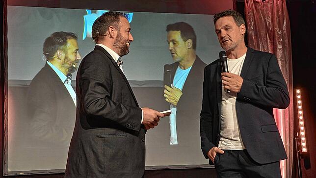 Moderator Reiner Jäckle im Gespräch mit Handball-Weltmeister Markus Baur.