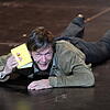 Schauspieler Sebastian Rudolph hält das gelbe Reclam-Heftchen in der Hand. 2011 wurde Nicolas Stemanns Inszenierung von Goethes Faust I ...