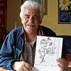 Abdelhamid Baioui zeigt seine Karikatur zur OB-Wahl in Rheinfelden.