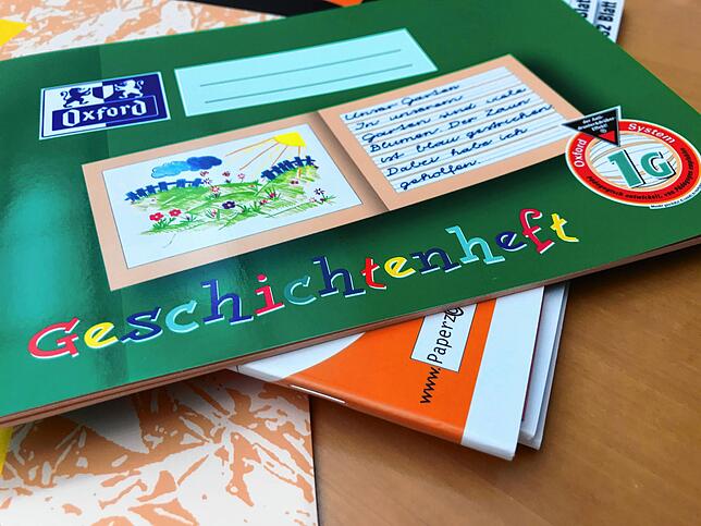 Nicht zu verwechseln mit dem Geschichtenheft, in das die Kinder auch noch Bilder malen können.