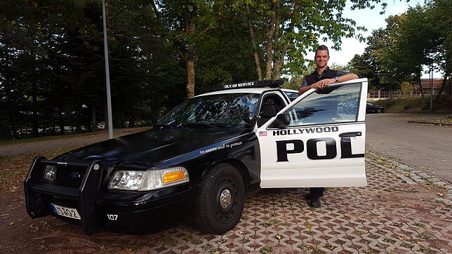 Andreas Hoffmann mit seinem Polizeiauto. Der Wagen war in der Stadt Hollywood in der Nähe von Miami in Florida im Einsatz, bevor er nach ...