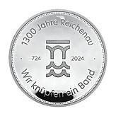 Die Jubiläumsmedaille in Silber. Auf der Rückseite der Sonderprägung ist das Jubiläumslogo und das Motto „Wir knüpfen ein ...