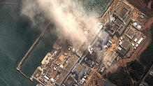 Ein Satellitenfoto des Atomkraftwerks in Fukushima, nur wenige Sekunden nach einer Reaktor-Explosion im Jahr 2011.