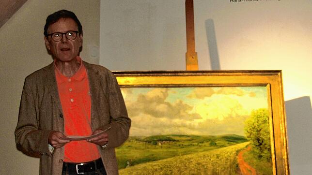 Jürgen Glocker stellt das Bild „Das Kornfeld“ vor. Bild: Karin Steinebrunner