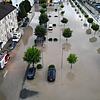Ein überschwemmter Aach-Center-Parkplatz mit angrenzenden vollgelaufenen Keller.