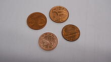 Die Eurocent-Münzen haben Doppelgänger in aller Welt, zum Beispiel in den USA und in Brasilien.